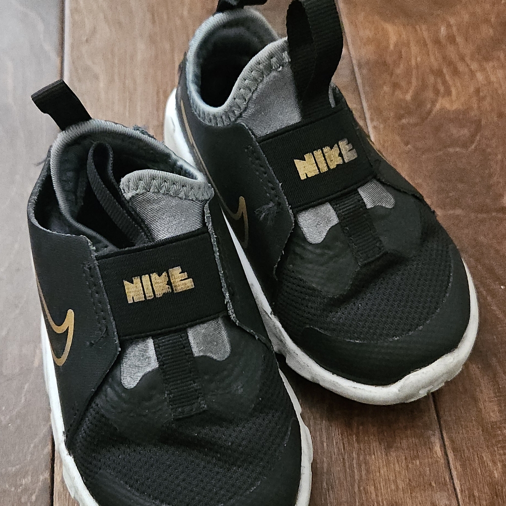 Nike Kids Black Sneakers with Gold Accents